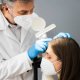 hair doctor examining a female patient's hair