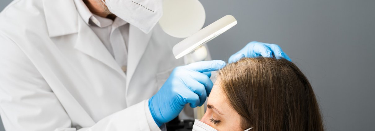 Hair Doctor Checking Woman Hair