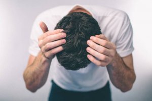 Men's hair is a top view close-up. ark-haired man Gray hair and Dandruff.